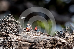 Group of miniature hikers having a break