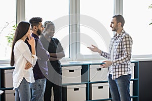 Group of mixed race Businesspeople having informal office meeting