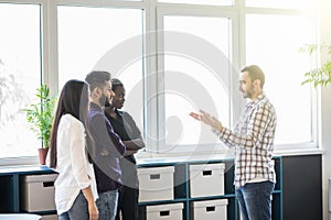 Group of mixed race Businesspeople having informal office meeting