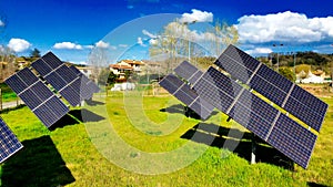 Group of Modern Solar Panels oriented to the sun photo