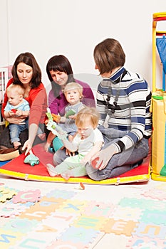 Group of mothers with their babies