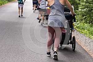 Group of mothers walking outside with their babies