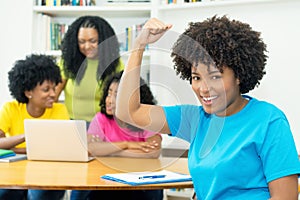 Group of motivated african american computer science students learning software development and programming