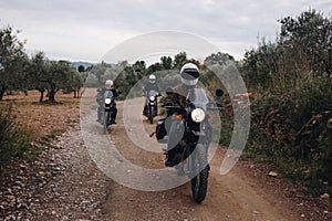 Group of motorcycle bikers on gravel dirt road