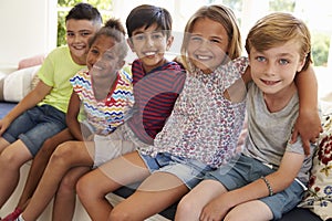 Group Of Multi-Cultural Children On Window Seat Together