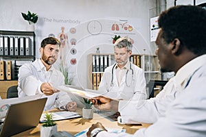 Group of multi ethnic doctors having international training