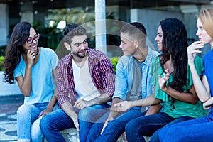 Group of multi ethnic young adults in poltical discussion