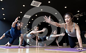 Group of multi ethnics people learning Yoga class photo