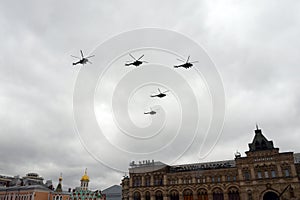 A group of multi-purpose Mi-8AMTSh helicopters in the sky over Moscow`s Red Square during the Victory Air Parade