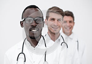 Group of multi-racial doctors standing in a row