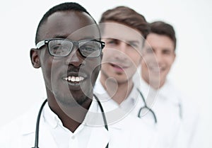 Group of multi-racial doctors standing in a row