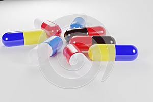 group of multicolored antibiotic capsules placed on white background, health