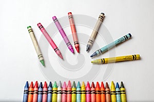 Group multicolored crayons messy and isolated on white background