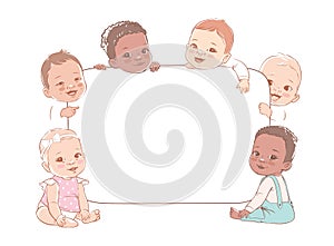 Group of multicultural baby boys and baby girls hold a blank board