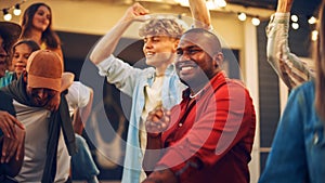 Group of Multicultural Diverse Friends and Relatives Having Fun and Dancing Together at a Garden