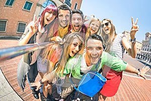 Group of multicultural tourists friends having fun taking selfie