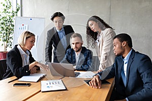 Group Of Multiethnic Business People Working On Laptop In Office