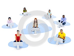 Group of Multiethnic People Sitting on a Cloud with Computer