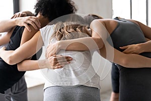 Group of multiethnic sporty people telling motivational pep talk.