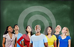 Group of Multiethnic Students Looking Up with Blackboard