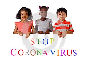 Group of multiracial children shows ``Stop Coronavirus`` . Concept 2019-nCov. Corona virus outbreaks.