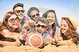 Group of multiracial happy friends having fun at beach games