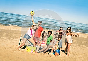 Group of multiracial happy friends having fun with beach games