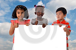 Group of multiracial kids portrait with white board.