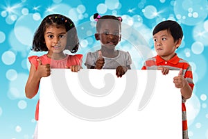 Group of multiracial kids portrait with white board.