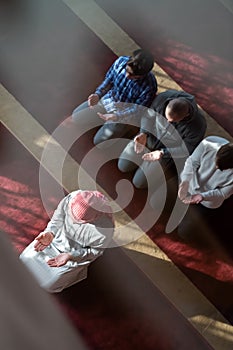 group of muslim people praying namaz in mosque.