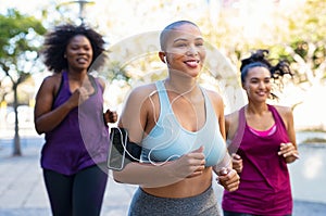 Group of natural curvy women jogging