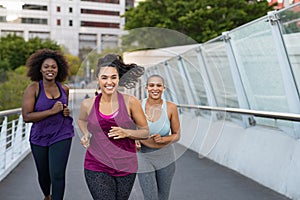 Group of natural women jogging photo