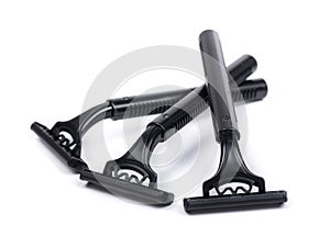 Group of new black plastic disposable shavers