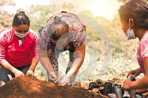 Group of Nicaraguan women planting trees in a rural area of Nicaragua