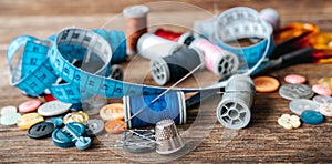 Group of objects about Sewing equipment set on a wooden background. Sewing and tailoring concept.