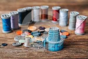 Group of objects about Sewing equipment set on a wooden background. Sewing and tailoring concept.