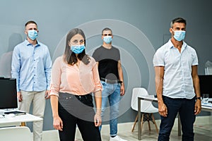 Group Of Office Employees Wearing Face Masks