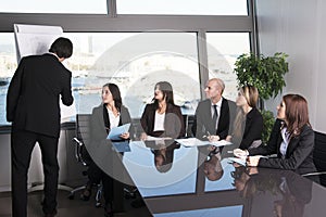 Group of office workers in a boardroom presentation