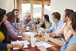 Group Of Office Workers Meeting To Discuss Ideas