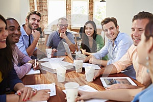 Group Of Office Workers Meeting To Discuss Ideas photo