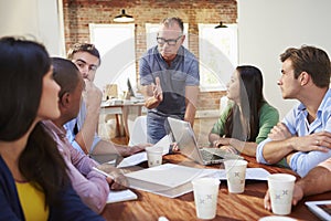 Group Of Office Workers Meeting To Discuss Ideas