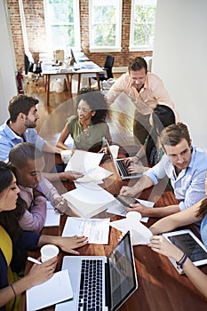 Group Of Office Workers Meeting To Discuss Ideas photo