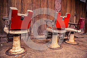 Group of old barber chairs.