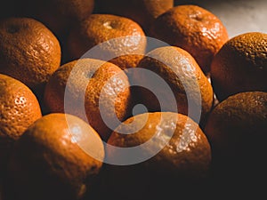 group of orange fruit under sunlight, close up shot, low saturation, matte tone