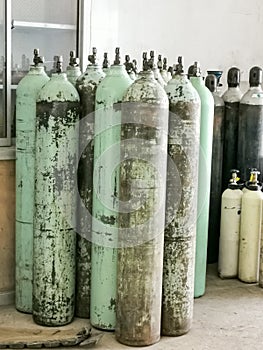 Group of oxygen cylinder tank with compressed gas for industrial use in the factory.