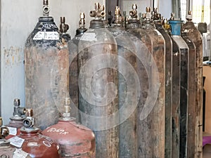 Group of oxygen cylinder tank with compressed gas for industrial use in the factory.