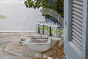 Group of oxygen, nitrox tanks for scuba diving in the sun waiting for tourists