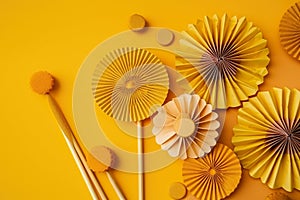 A group of paper fans next to a pair of chopsticks. AI generative image