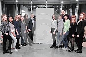 Group of participants of the workshop standing in the lobby of the conference hall.