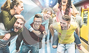 Group of party friends having fun in underground metropolitan station - Young people ready for night out  - Friendship and party